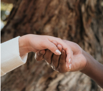 Interracial hands holding each other